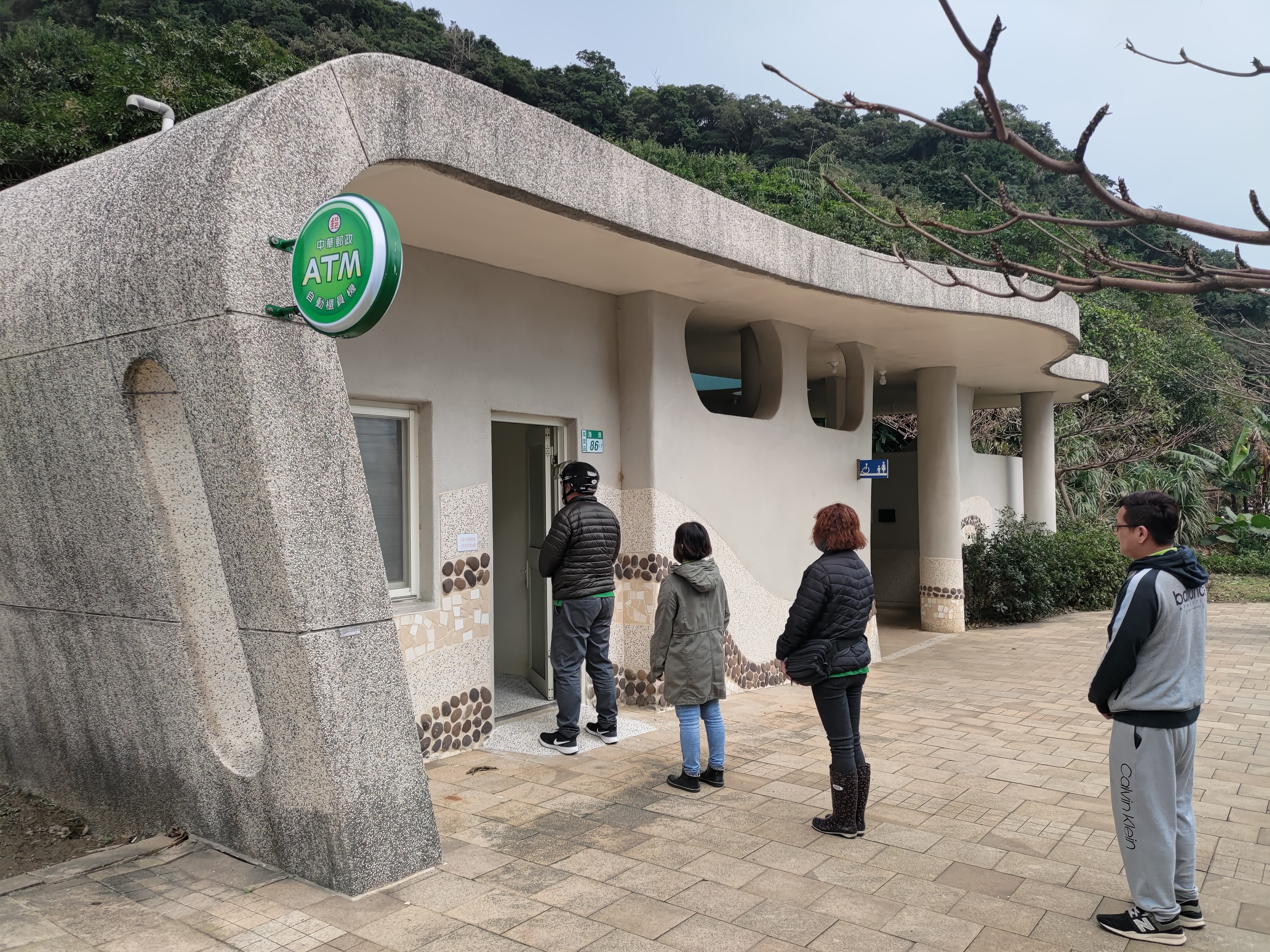 ATM in Guihou with travelers